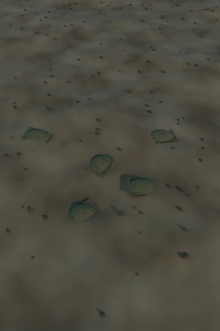 Desert terrain with scrub where camouflaged vehicles are hidden under nets