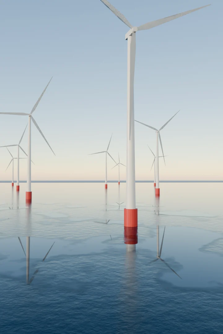 Offshore wind turbines standing in a calm sea under a pale sky